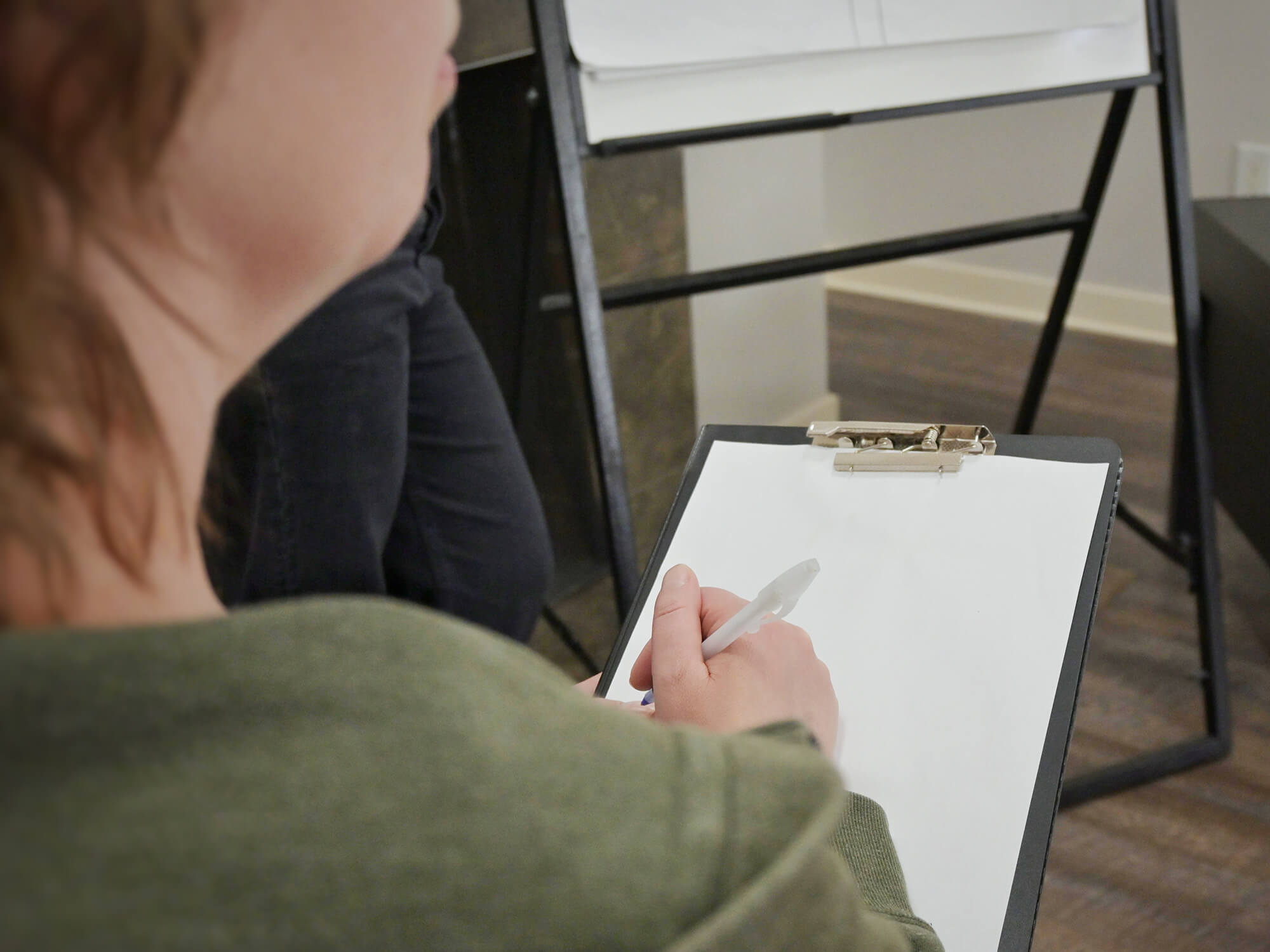 woman taking notes